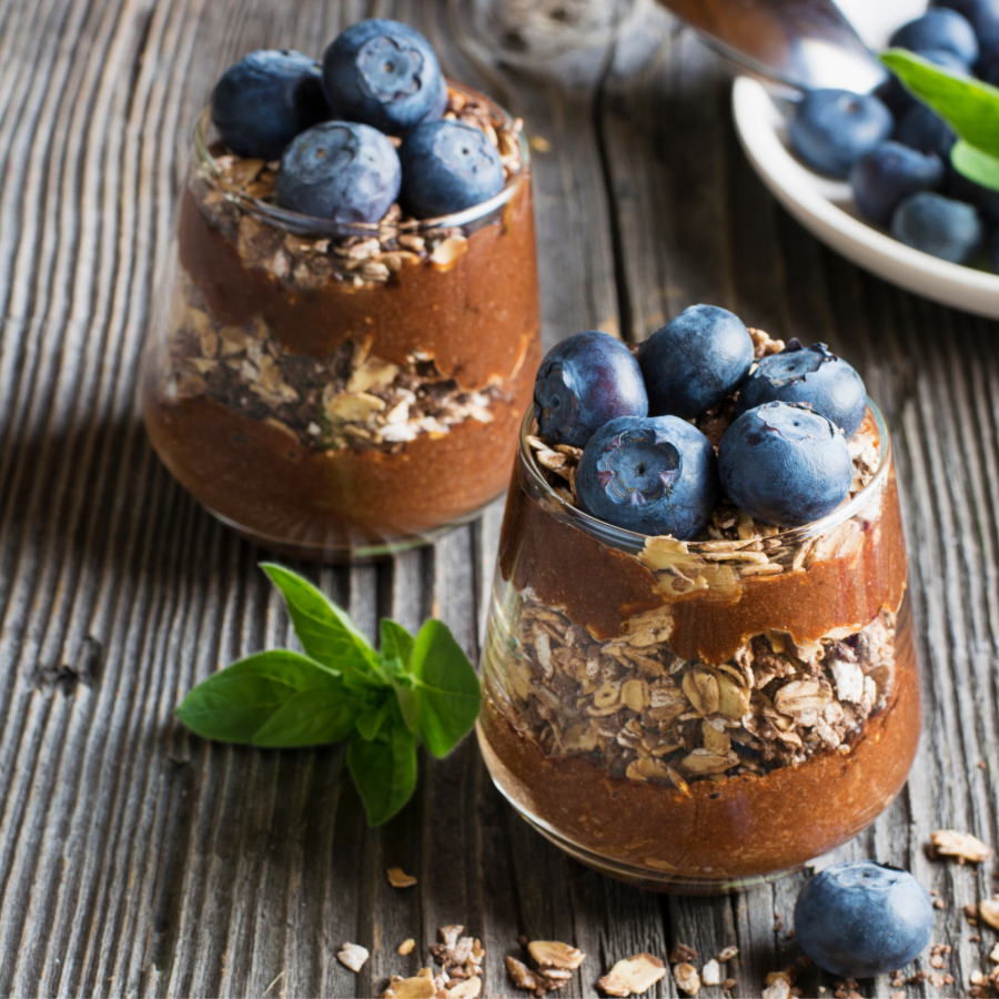 Granola And Blueberries Topping Chocolate Banana Smoothie Parfaits With Chocolaty Collagen Fuel From Terra Powders