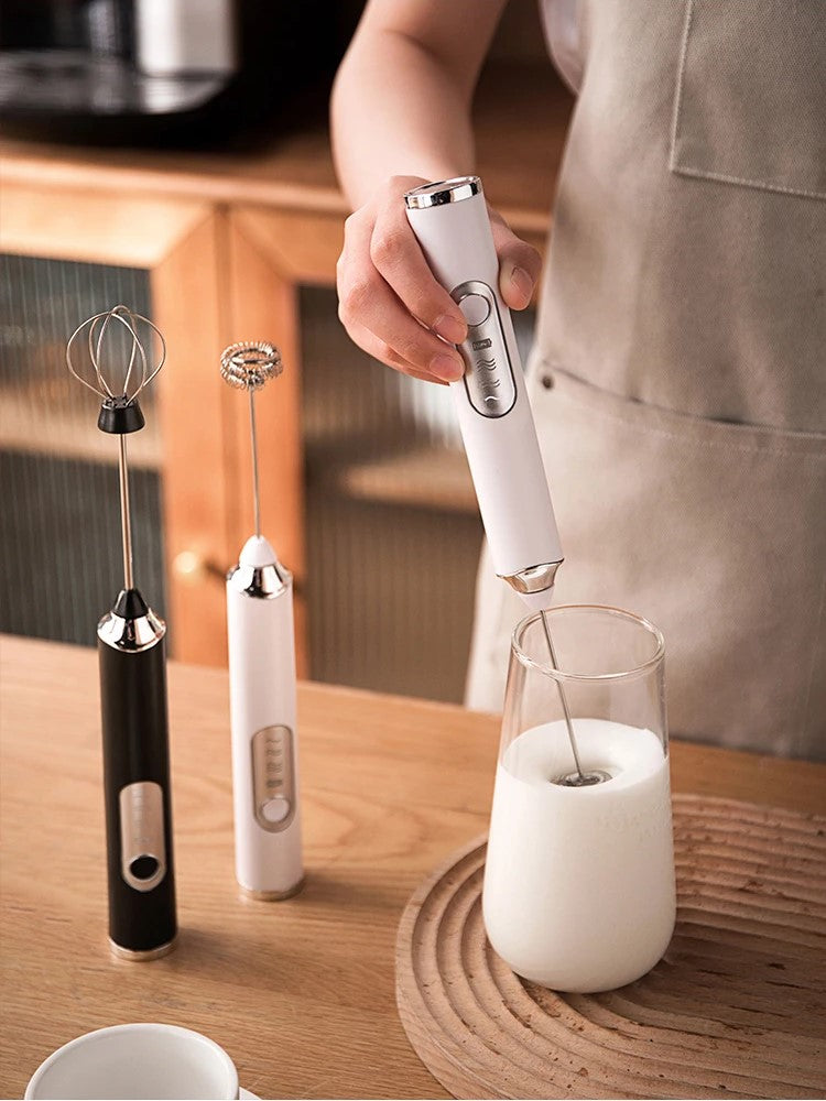 Barista Using Modern Handheld Milk Frother Wands For Frothing Milk For Lattes