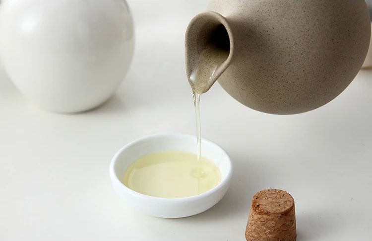 Pouring Oil From Ceramic Oil Jar Organic Modern Style Pottery Jug With Cork Lid