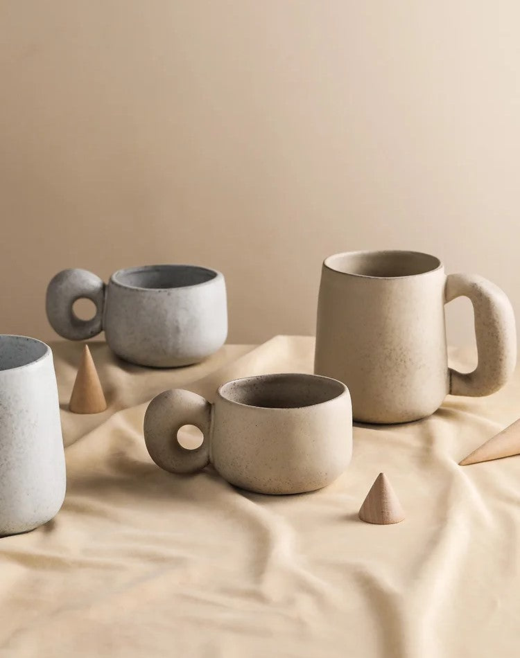 Organic Retro Style Ceramic Mugs In Shallow And Deep Sizes With Chunky Handles And Neutral Colors