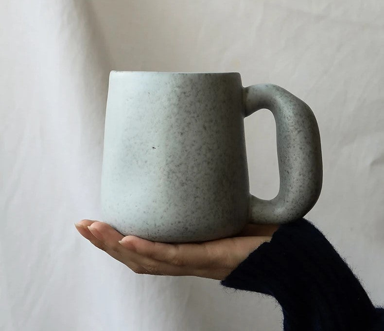Holding A Ceramic Mug With Oversized Handle Design Organic Retro Style Pottery