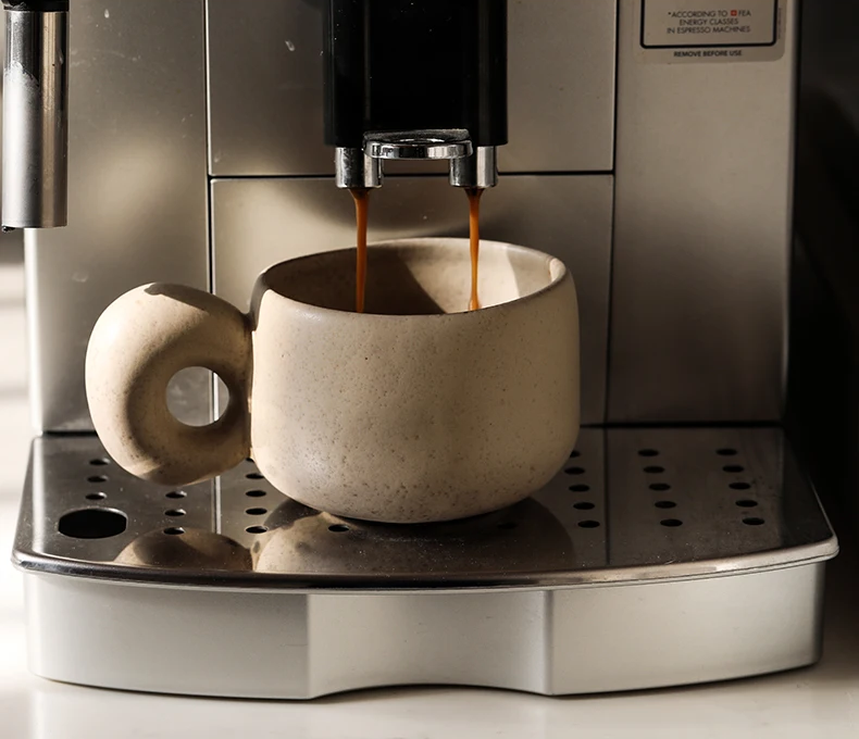 Making Espresso Coffee In Retro Style Shallow Mug With Organic Shape Handle