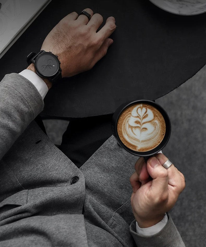 Business Man With Coffee Latte Made Using Modern Style Handheld Milk Frother Barista Tool That Is USB Rechargeable