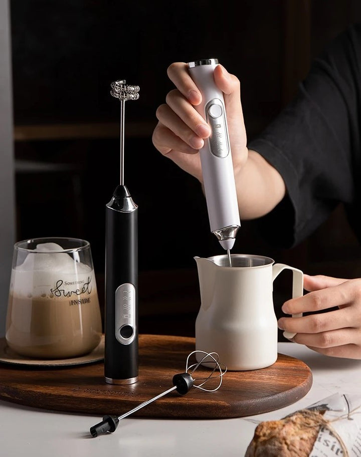 Frothing Milk For Homemade Iced Latte Using Modern Handheld Milk Frother Wands