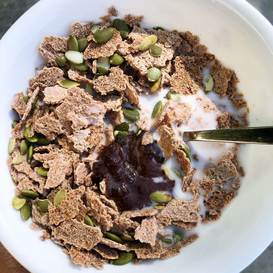 Bowl Of NUCO Grain Free Coconut Crunch Cereal And Pumpkin Seed Topping