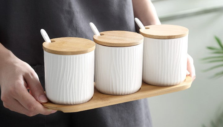 Carrying 3 Off White Coconut Color Pottery Canisters With Wavy Pattern Organic Seaside Style Jars With Lids And Spoons On Bamboo Tray