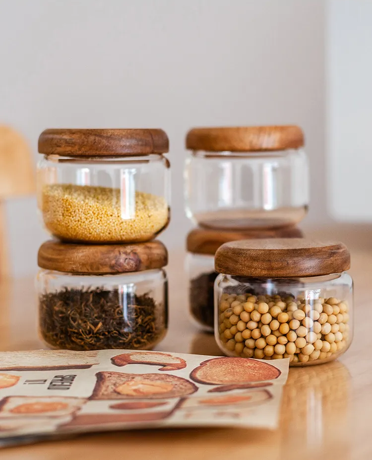 Storing Pantry Goods In Clear Jars Glass Canisters With Wooden Lids Loose Leaf Teas Dried Beans And More
