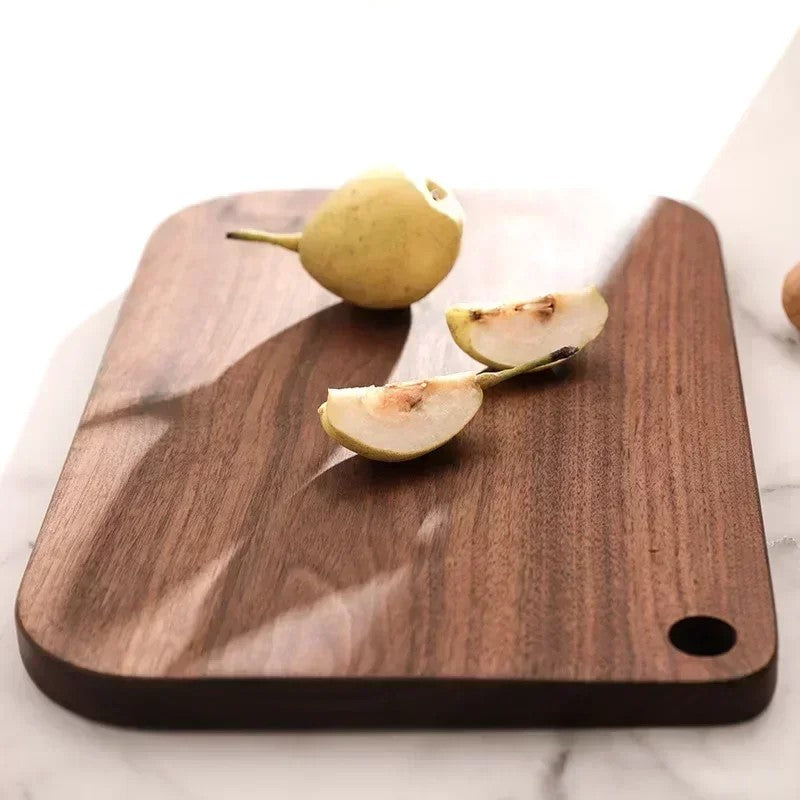 Fresh Cut Pear Fruit On Wooden Walnut Cutting Board