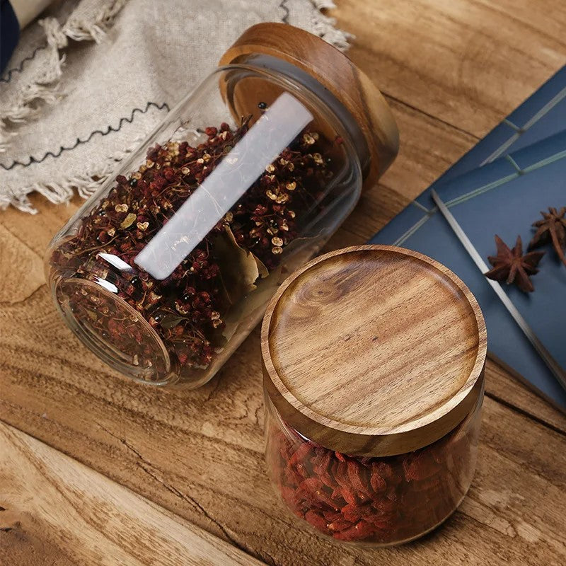 Glass Jars With Acacia Wood Lids For Food Storage In Style Goji Berries And Healthy Herbs In Wilderness Collection Canisters
