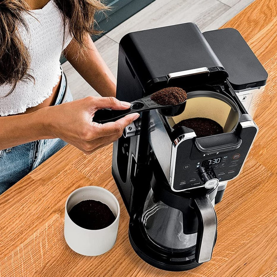 Making Coffee With Reusable Gold Toned Coffee Filter