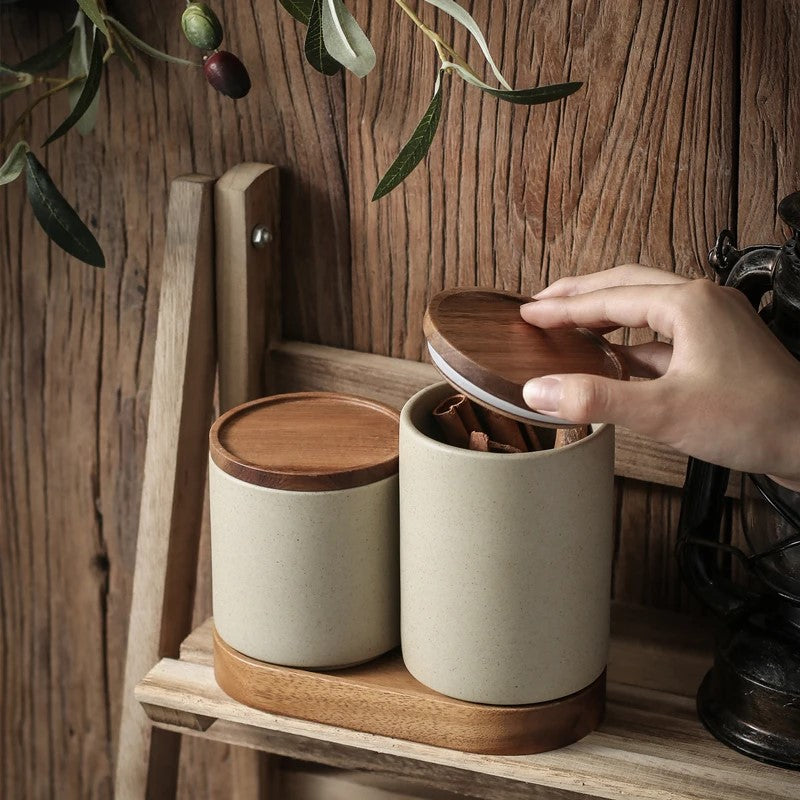 Opening Ceramic Jar With Cinnamon Sticks In It Sealable Wood Lid On Ceramic Canister And Wooden Tray