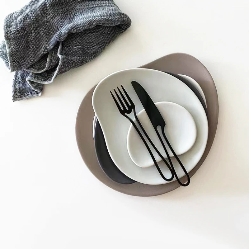 Organic Shape Dishes With Minimalist Black Flatware Stainless Steel Fork And Knife