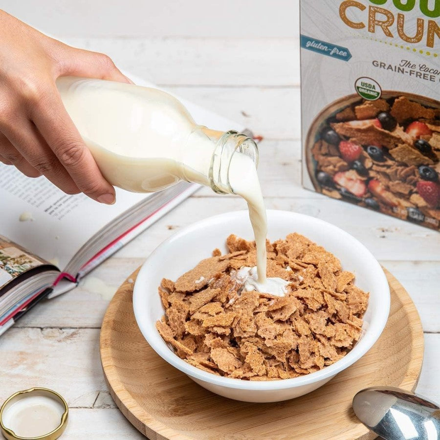 Pouring Plant Based Milk Into Gluten Free Grain Free Cereal NUCO Original Coconut Crunch Healthy Breakfast Idea