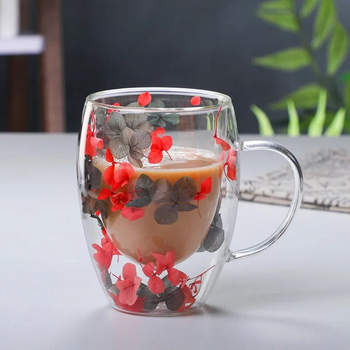 Coffee In Glass Mug Filled With Black And Red Hydrangea Flower Petals