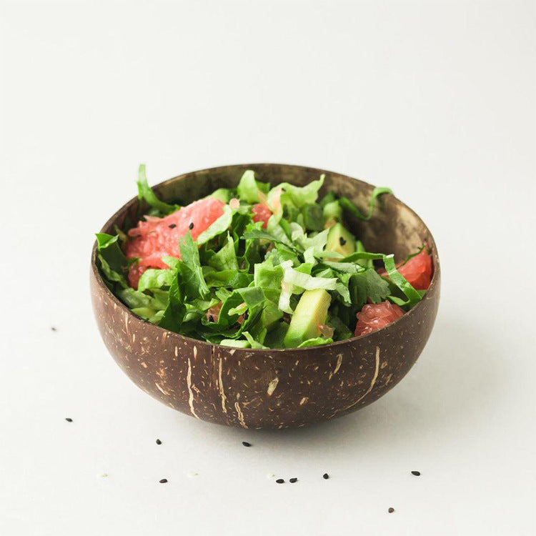 Fresh Salad Served In Natural Coconut Shell Bowl