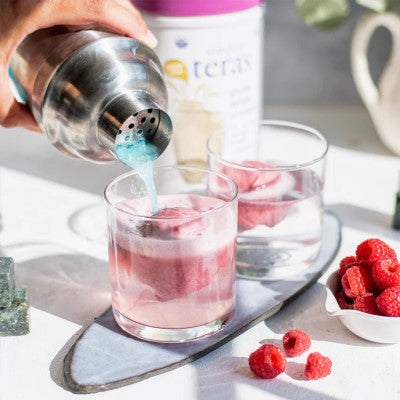 Pouring Drinks With Raspberries Simply Liberty Cocktail Recipe Using Simply Teras Non-GMO Plain Unsweetened Whey Powder
