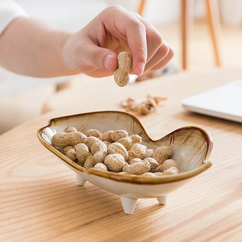 Snacking Legume Nuts Out Of Peanut Shape Ceramic Dish