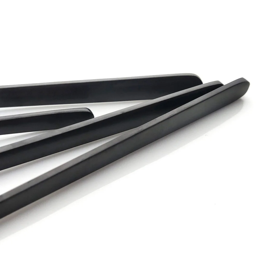 Sleek Black Handles On Surreal Stainless Steel Silverware Sets