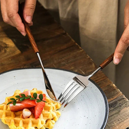 Using Stainless Steel Metal Dinner Knife And Fork Utensils With Rosewood Handles