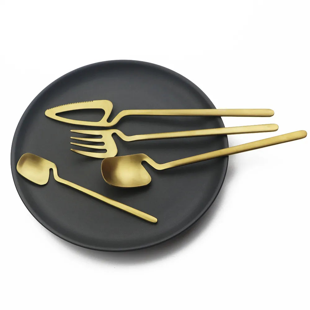 Gold Flatware On Black Plate Surreal Stainless Steel Silverware In Unique Avant Garde Style Decor