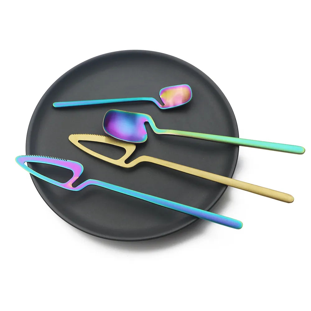 Black Plate With Silverware In Unique Shapes And Gradient Colors Iridescent Rainbow Flatware Pieces