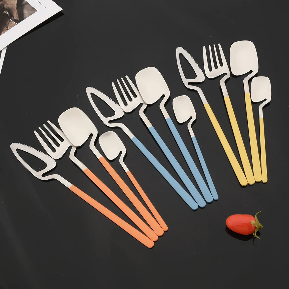 Surreal Style Silverware With Colorful Handles In Orange Blue And Yellow