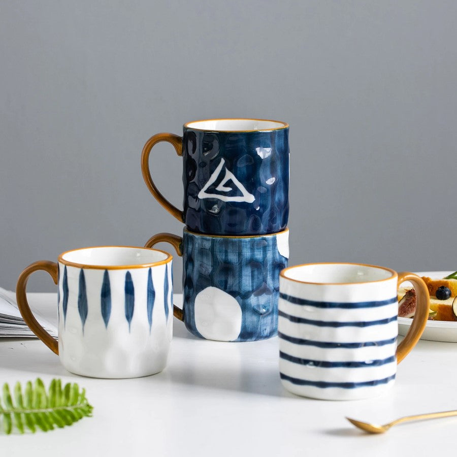 Four White And Blue Pattern Prints Of Nautical Style Mugs
