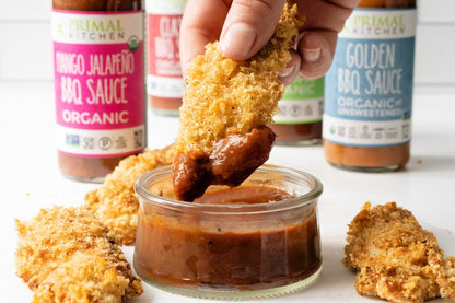Dipping Air Fryer Ranch Chicken Tenders In Organic Primal Kitchen BBQ Sauces