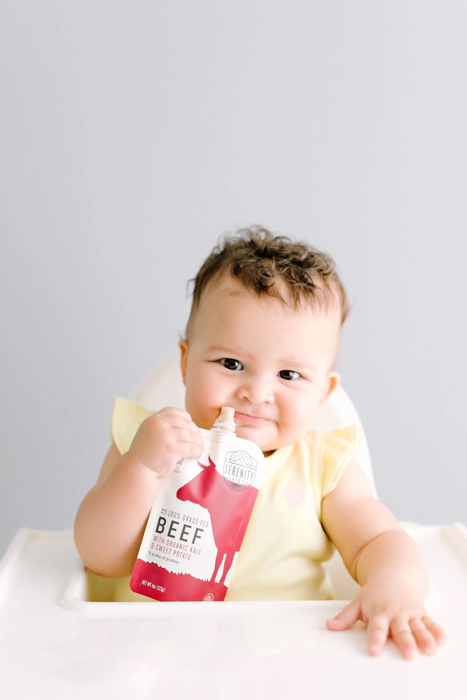 Baby Enjoying Grass Fed Beef Baby Food Serenity Kids Pouch