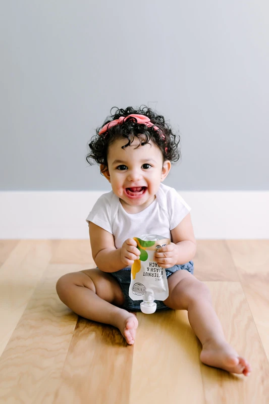 Baby Enjoying Organic Squash And Spinach Baby Food Serenity Kids Pouch