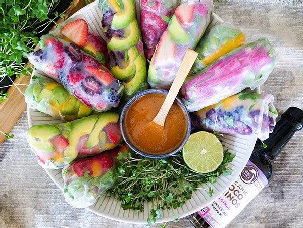 Fresh Rice Paper Rolls Filled With Fruit Berries And Vegetables And Dipping Sauce Made With Non-GMO Coconut Amino Sauce From Big Tree Farms
