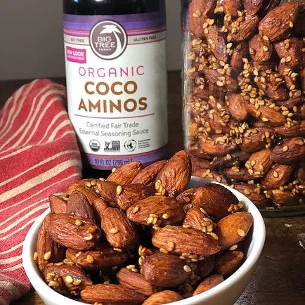 Big Tree Farms Coco Aminos With Dish Of Spiced Almonds