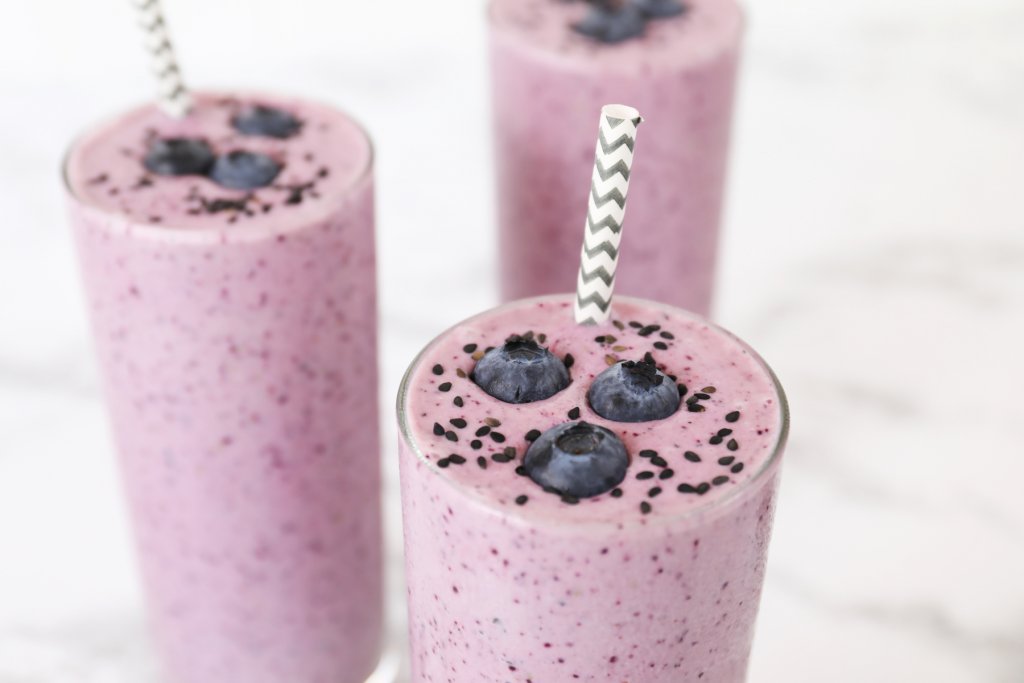 Close Up Of Black Sesame Seed Topped Blueberry Agave Smoothies Made With Organic Madhava Agave