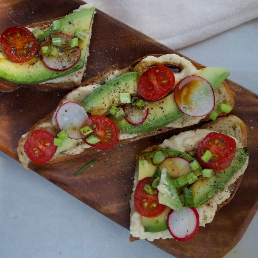Bread Slices Topped With Tomato Radish And Avocado