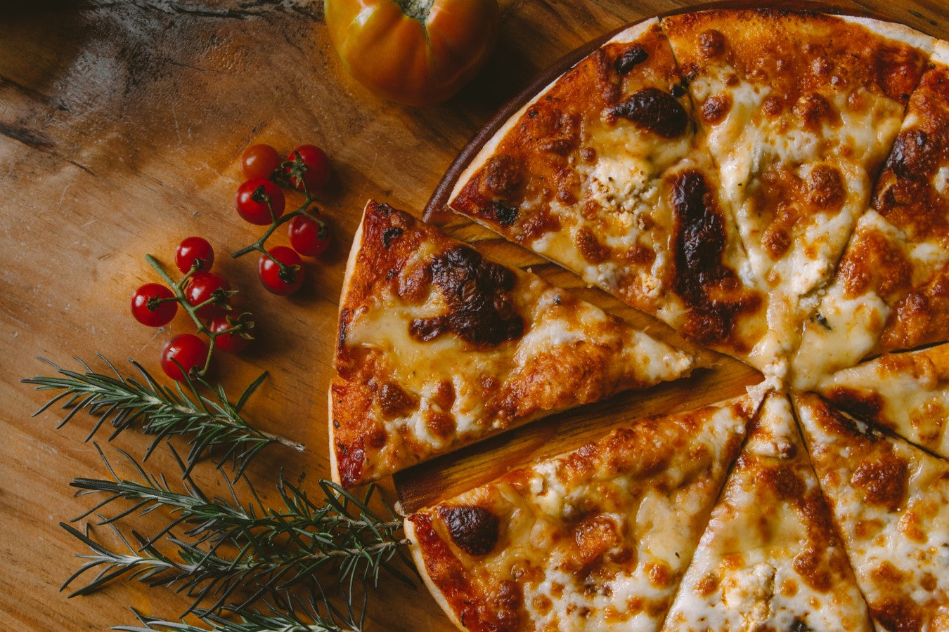 Cheesy Pizza With Fresh Rosemary And Tomatoes
