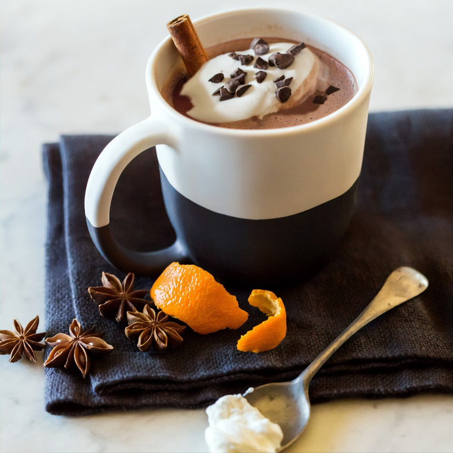 Cocoa Nibs Topping Mug Of Hot Chocolate With Cinnamon Stick Star Anise And Citrus