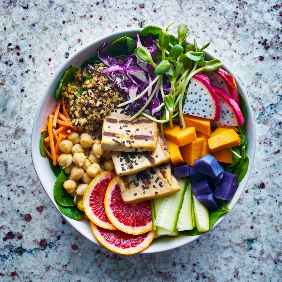 Beautiful And Colorful Buddha Bowl Of Organic Tricolor Quinoa Dragon Fruit Sprouts Chickpeas Tofu Cabbage And Other Healthy Veggies
