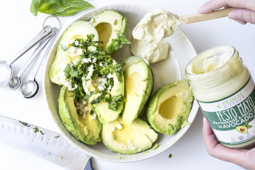 Making Creamy Guacamole With Fresh Avocados Basil And Mayonnaise Pesto Blend From Primal Kitchen