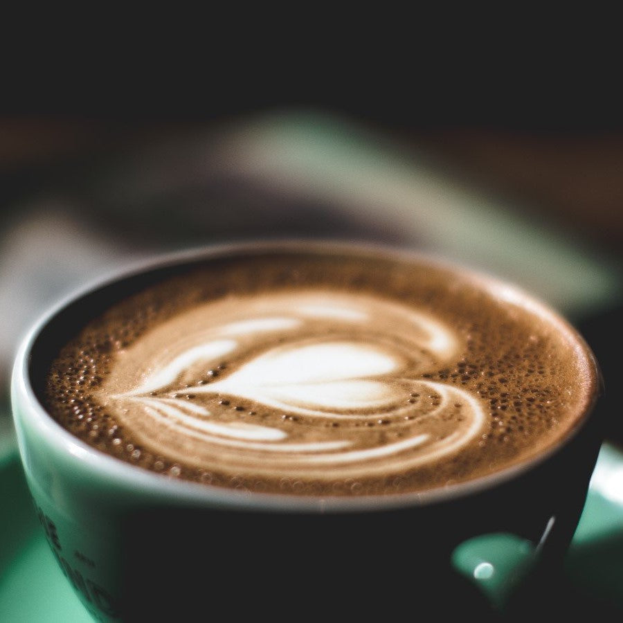 Dark Roast Sweet Love Coffee Latte In Green Mug And Saucer