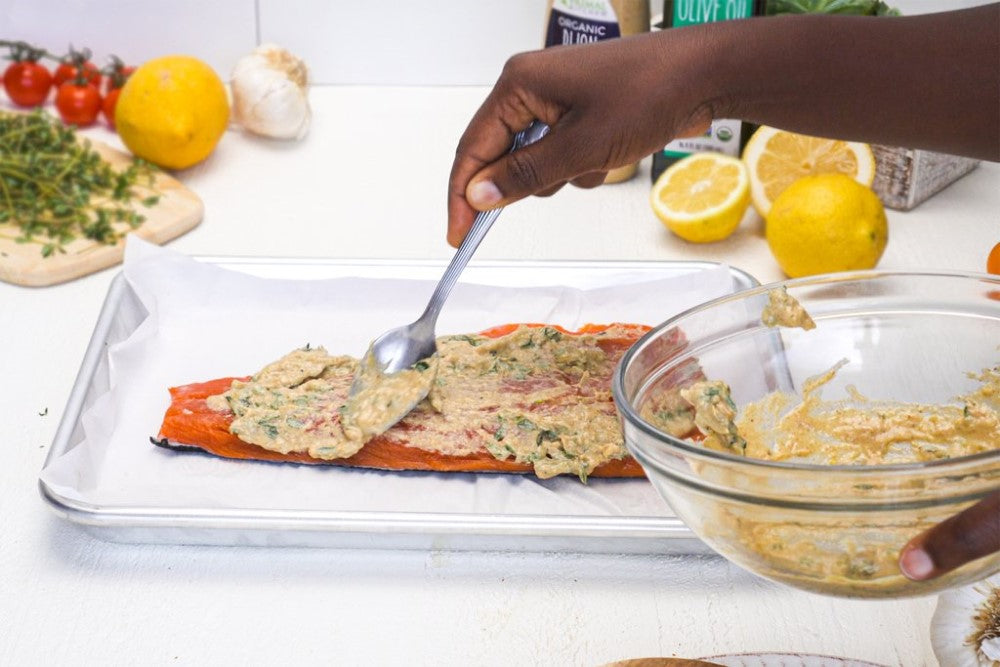 Spreading Flavorful Topping On Fish For Primal Kitchen Recipe Dijon Mustard Salmon