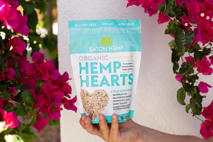 Holding A Bag Of Healthy Hemp Hearts Gluten Free Vegan Eaton Hemp Superfood