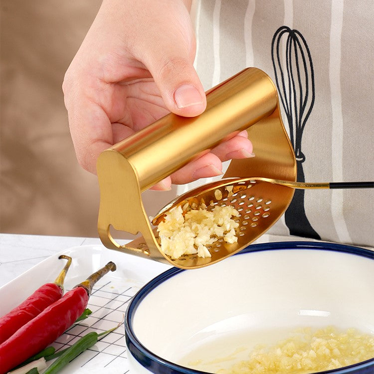 Making Recipes With Fresh Garlic Is Easy With The Gold Color Stainless Steel Curved Garlic Rocker Press