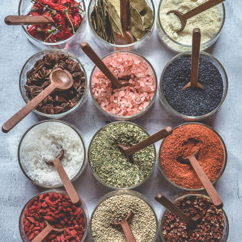 Chili Peppers Bay Leaves Dried Spices Pink Salt Herbs Goji Berries Tea And More In Glass Food Jars With Acacia Wood Spoons