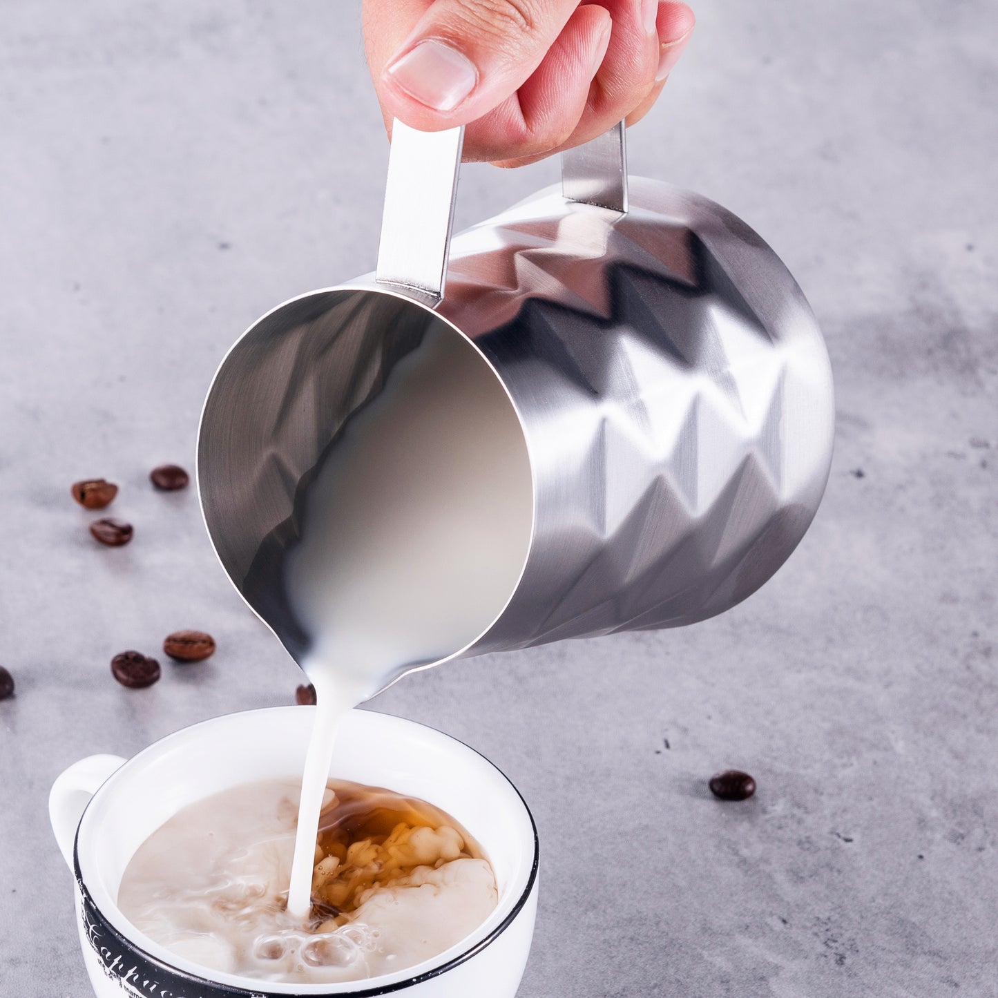 Pouring Cream Out Of Mini Milk Pitcher In Stylish Prism Design For Coffee Creamer