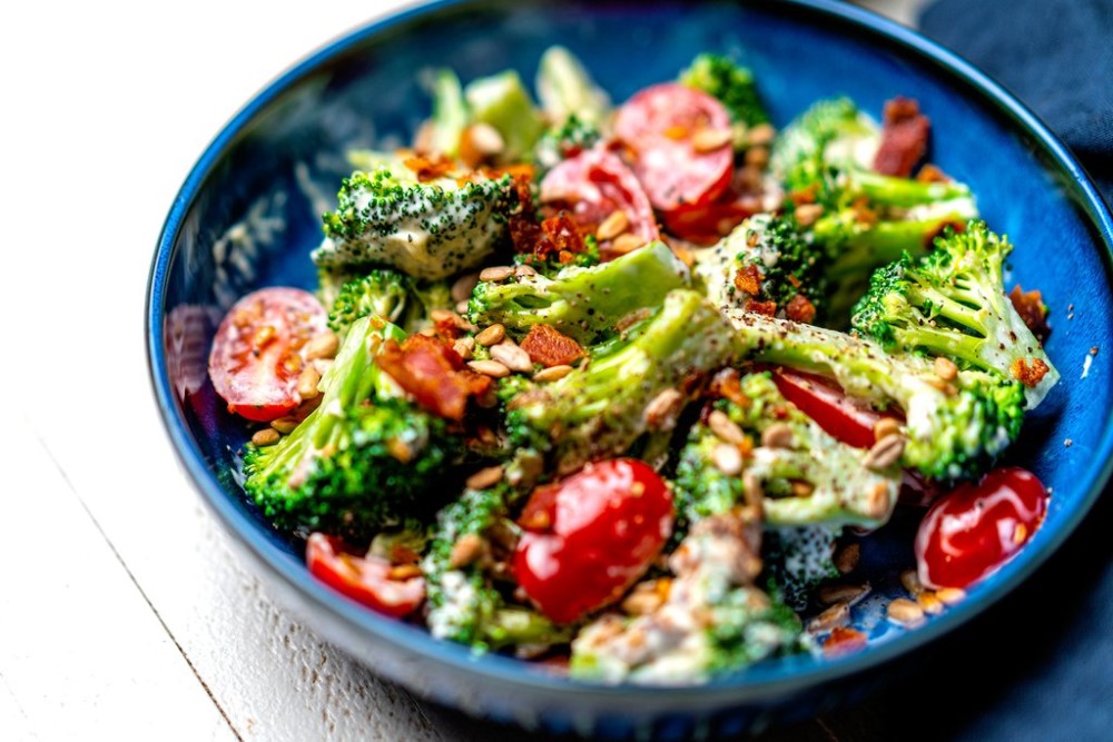 Keto Broccoli Salad In Blue Bowl Topped With Aioli Garlic Mayo Primal Kitchen Recipe