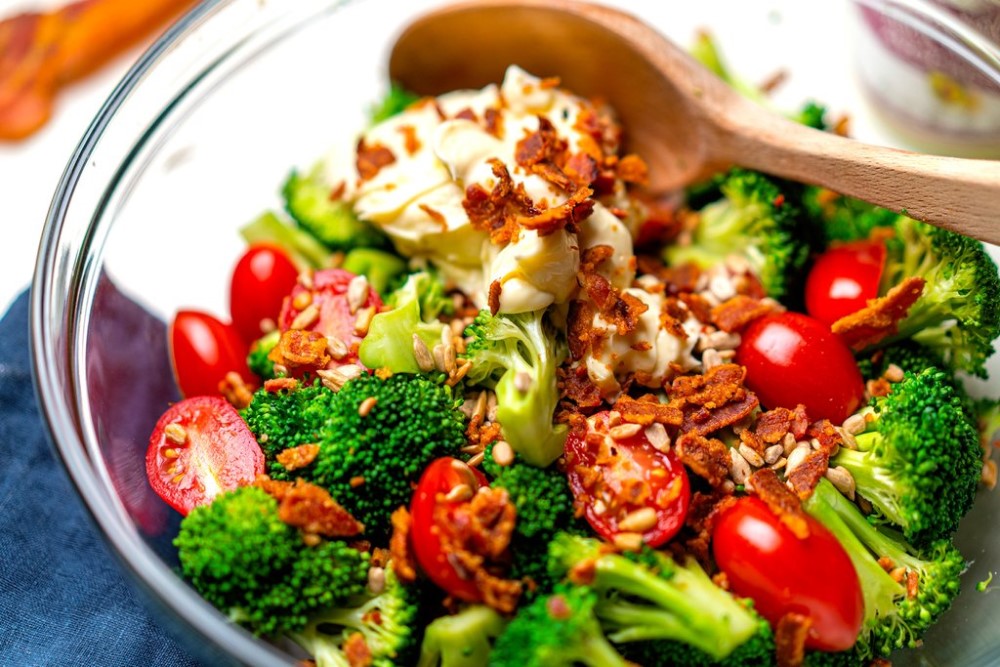 Ingredients In Bowl For Primal Kitchen Healthy Recipe Keto Broccoli Salad Using Garlic Aioli Mayo