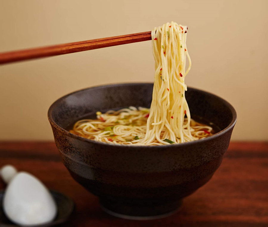 Using Chopsticks To Enjoy Bowl Of Healthy Ramen Soup Made With Organic Lotus Foods Millet Brown Rice Ramen Noodles