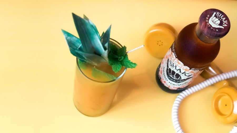 Shaka Tea Recipe Mango Hibiscus Mojito Cocktail Posed With Yellow Phone Bottle Of Iced Tea From Honolulu