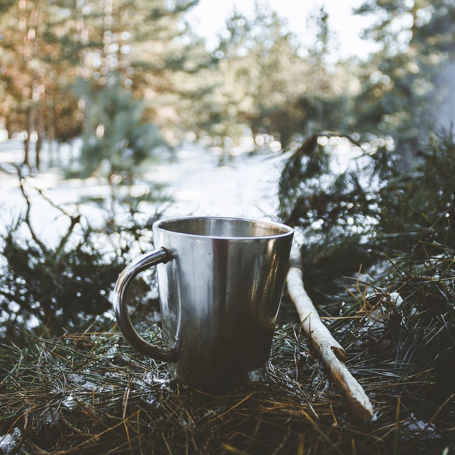 Silver Metal Mug Outdoors With Organic American Green Yaupon Holly Tea From Terra Powders