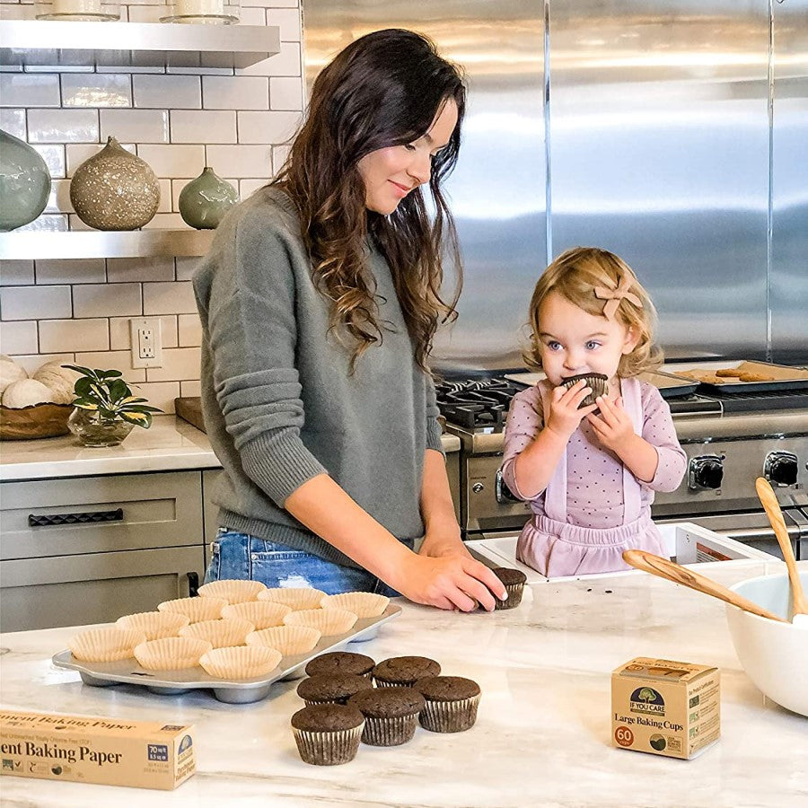 Mother And Daughter Baking Cupcakes In Kitchen Together Using Eco-Friendly If You Care Baking Products